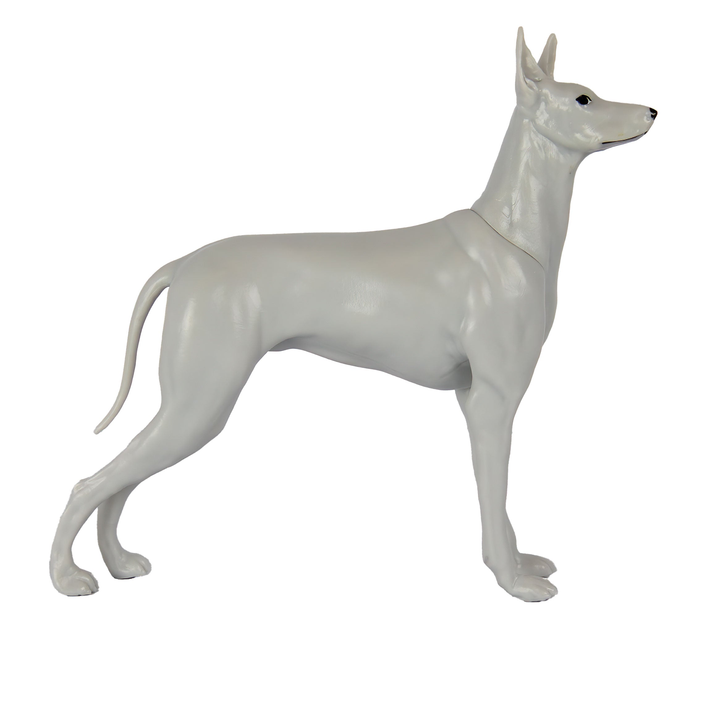 White dog figurine on a white background