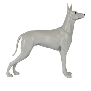 White dog figurine on a white background
