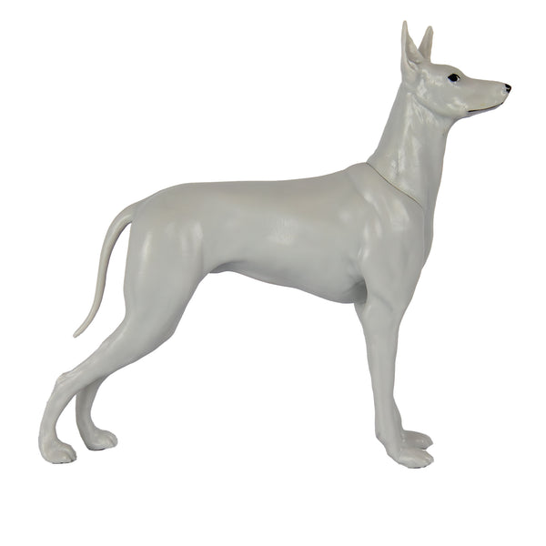 White dog figurine on a white background