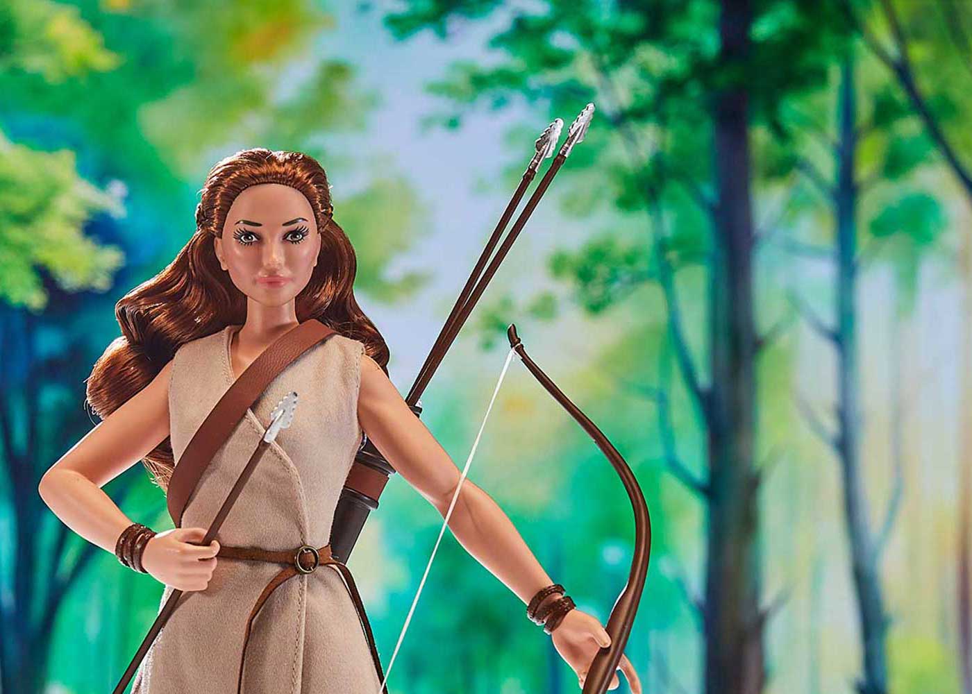 Artemis doll with bow and arrow in forest