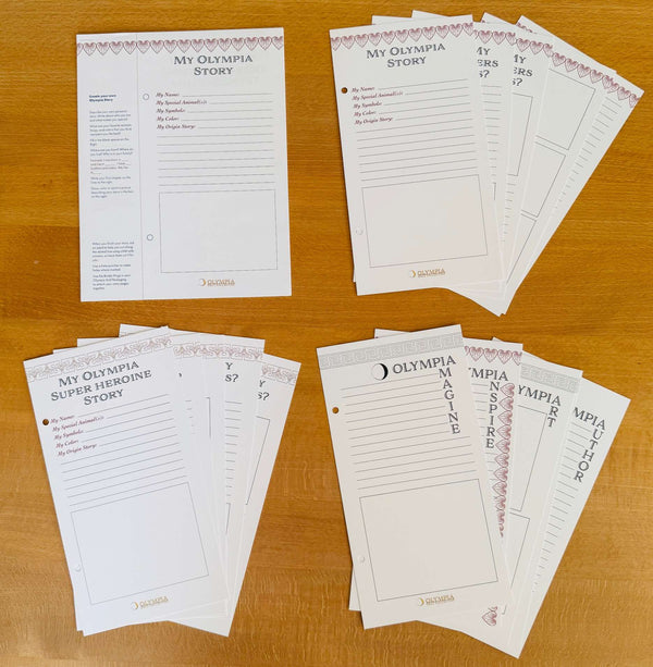 Collection of printed story templates on a wooden surface